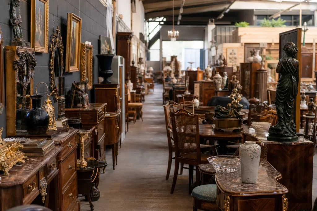 shoppers browsing antique and vintage market stalls at Harelbeke-Punt Antiques in Belgium