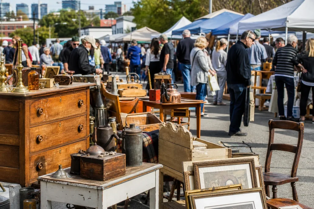 shoppers browsing antique and vintage market stalls at Hillhurst Sunnyside Community Association Flea Market in Alberta, Canada