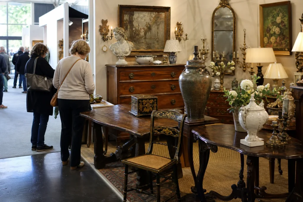 shoppers browsing antique and vintage market stalls at Hillsborough Antiques + Art + Design Show in San Francisco