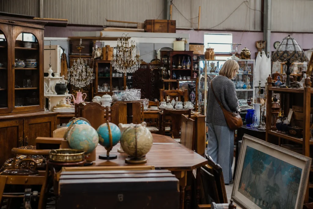 shoppers browsing antique and vintage market stalls at How Bazaar Antiques and Collectibles in Victoria