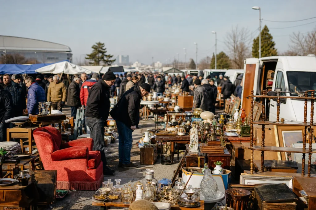 shoppers browsing antique and vintage market stalls at Hrelic Flea Market in Croatia