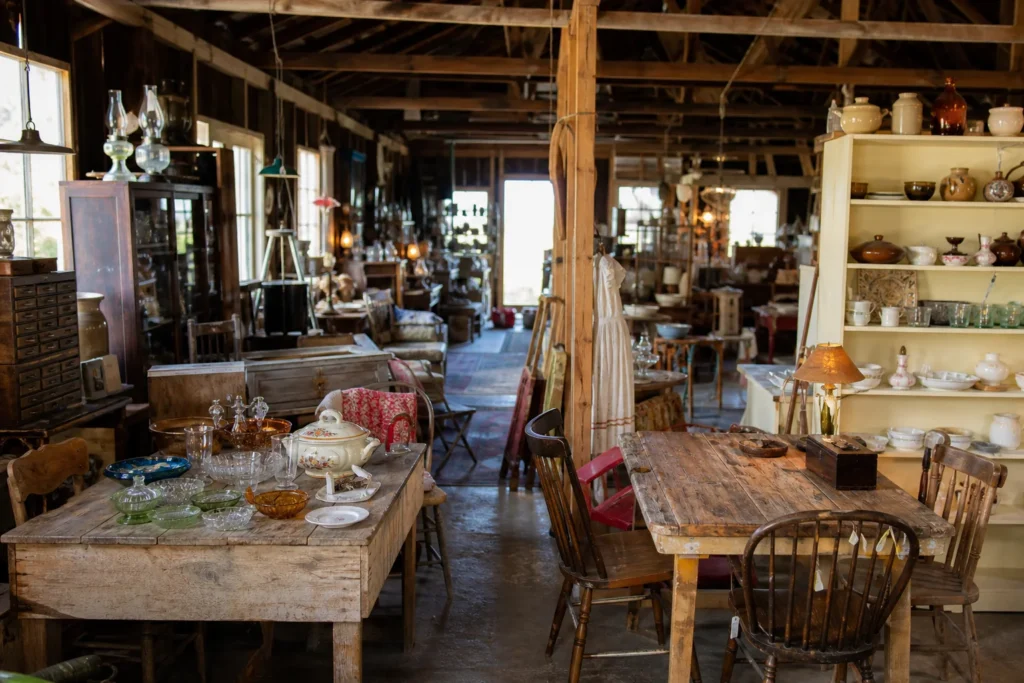 shoppers browsing antique and vintage market stalls at Kinder Surprises Antiques in Saskatchewan