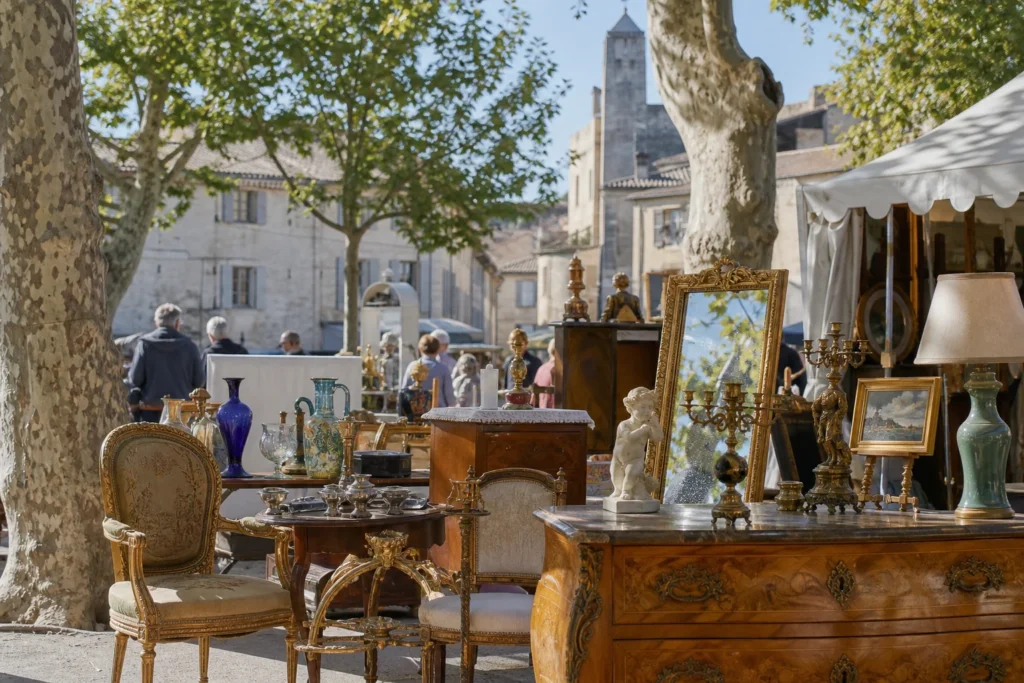 shoppers browsing antique and vintage market stalls at LAPADA in Place Charles David, 30400 Villeneuve-lès-Avignon, France