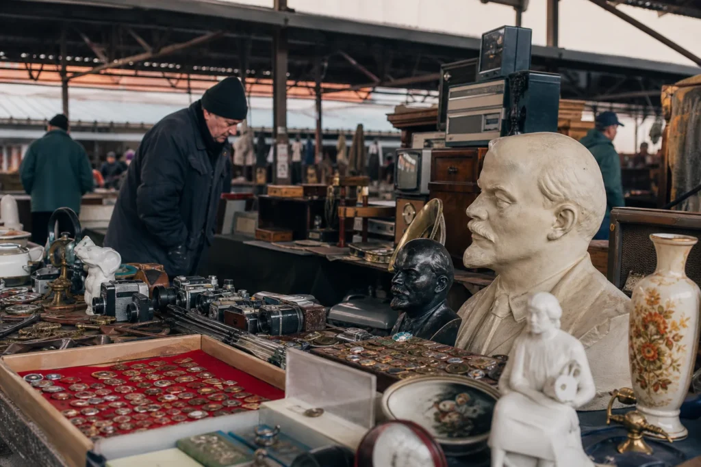 shoppers browsing antique and vintage market stalls at Latgale Tirgus Flea Market in Latvia
