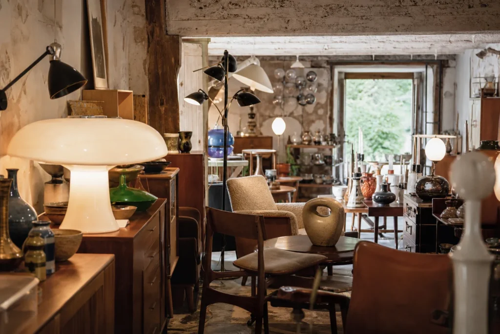 shoppers browsing antique and vintage market stalls at Le Havre Vintage in France
