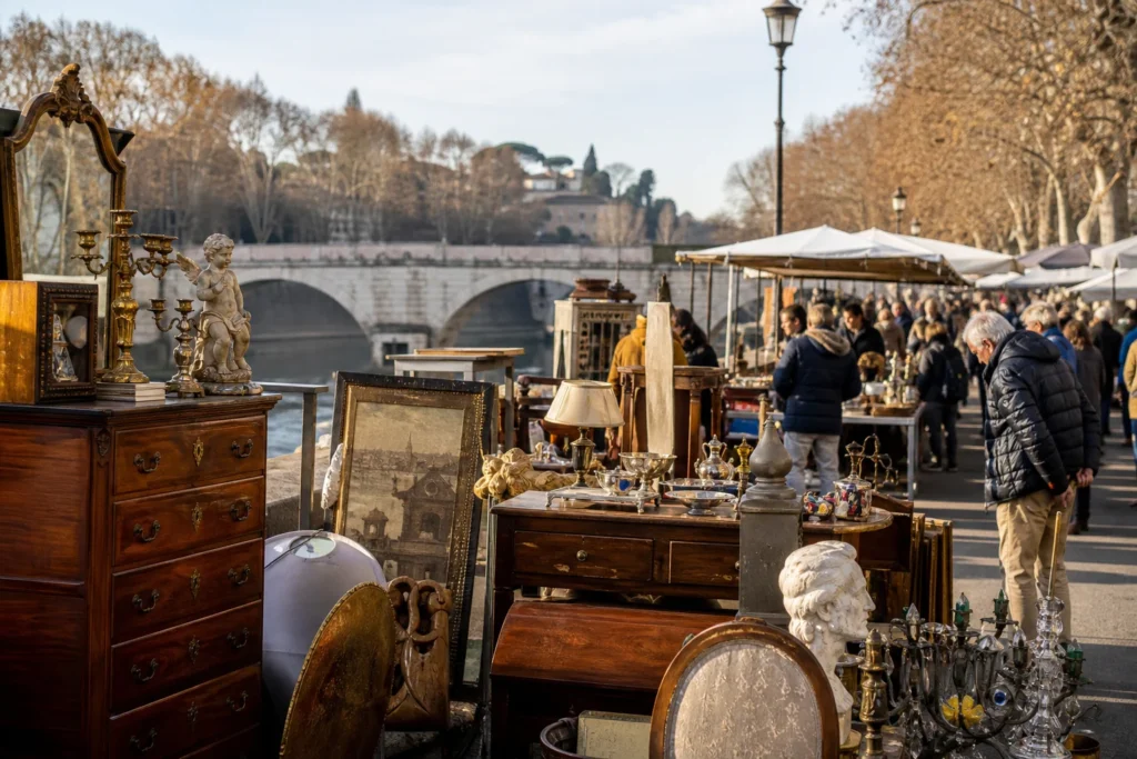 shoppers browsing antique and vintage market stalls at Mercatino antiquariato di Ponte Milvio in Italy, Rome