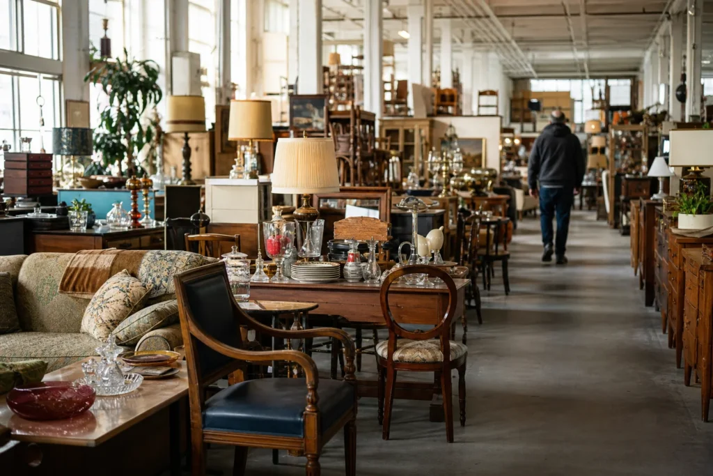 shoppers browsing antique and vintage market stalls at Meubles Bazar Grand Berger in Montreal