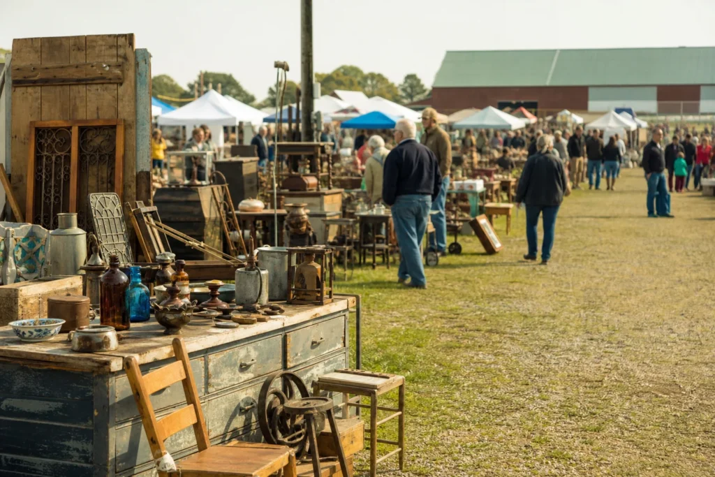 shoppers browsing antique and vintage market stalls at Michigan Antique & Collectible Festival Midland