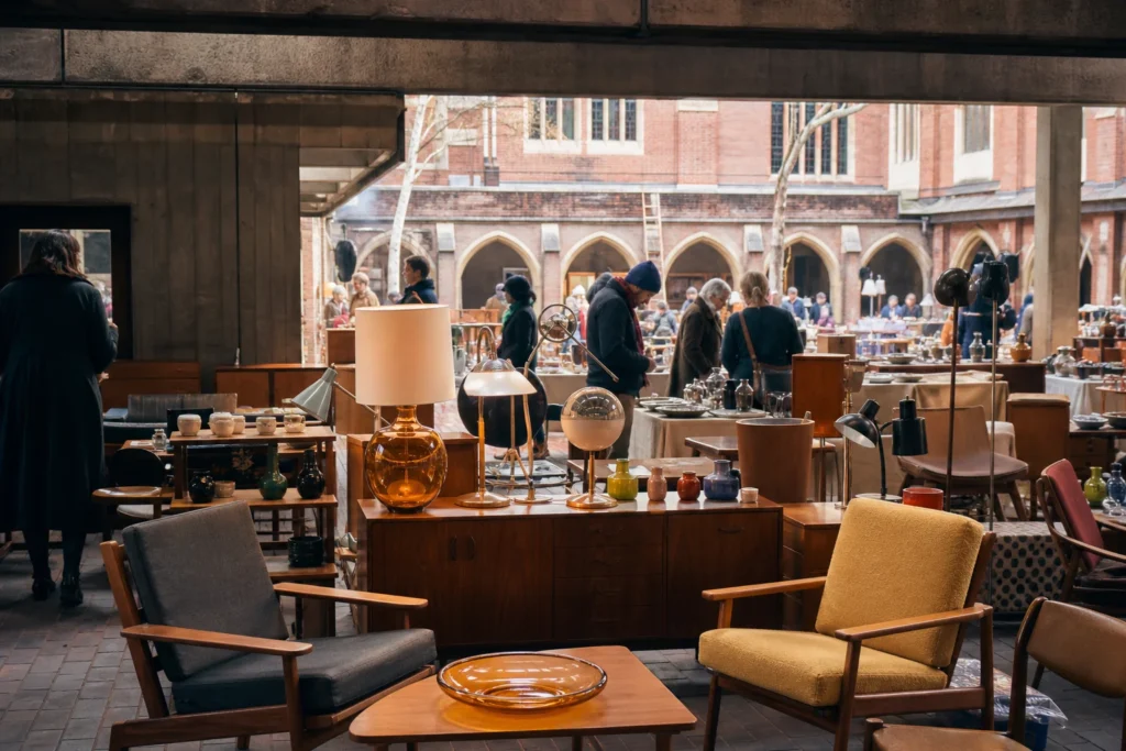 shoppers browsing antique and vintage market stalls at Midcentury Modern in London