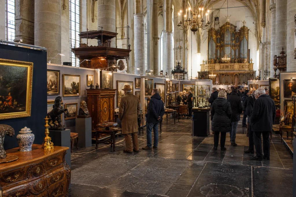 shoppers browsing antique and vintage market stalls at Naarden the Art Fair in Netherlands
