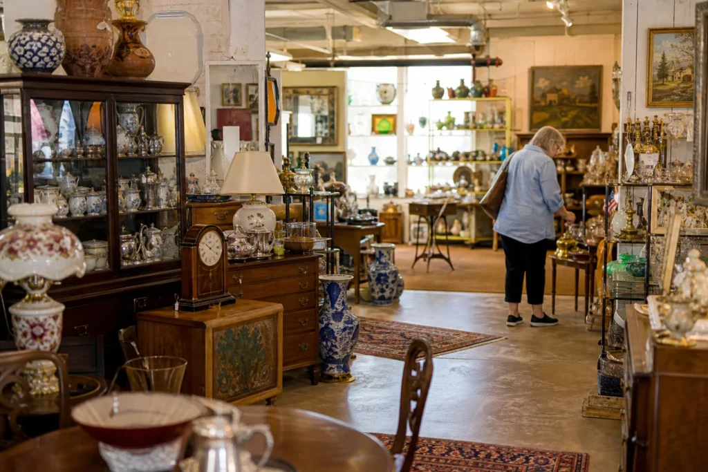shoppers browsing antique and vintage market stalls at New Hampshire Antique Co-Op