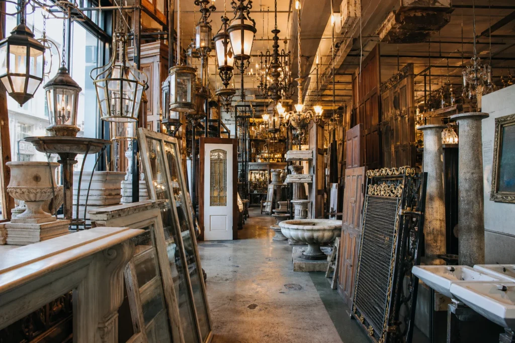 shoppers browsing antique and vintage market stalls at Olde Good Things Madison Ave in New York City, New York State