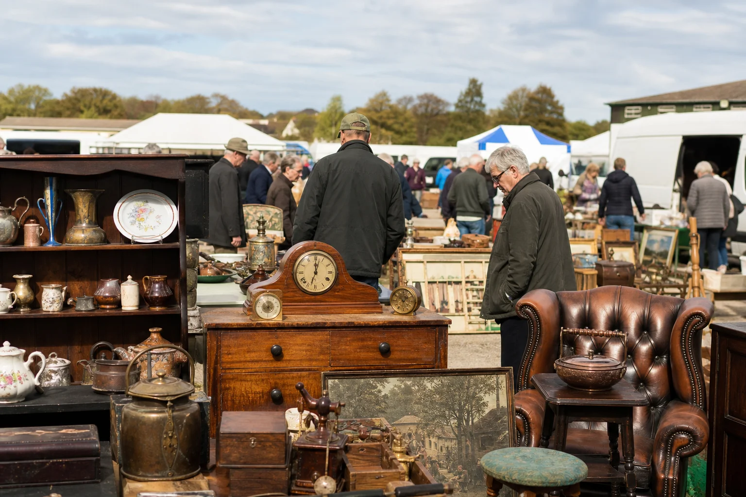 shoppers browsing antique and vintage market stalls at Oswestry Antique & Collectors Fair in United Kingdom