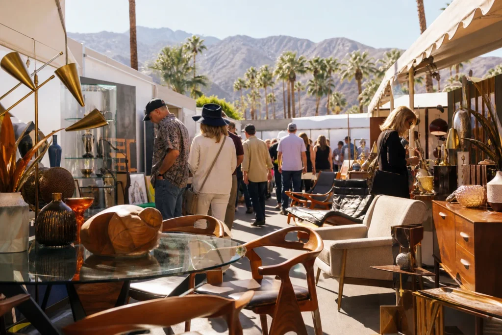 shoppers browsing antique and vintage market stalls at Palm Springs Modernism in California