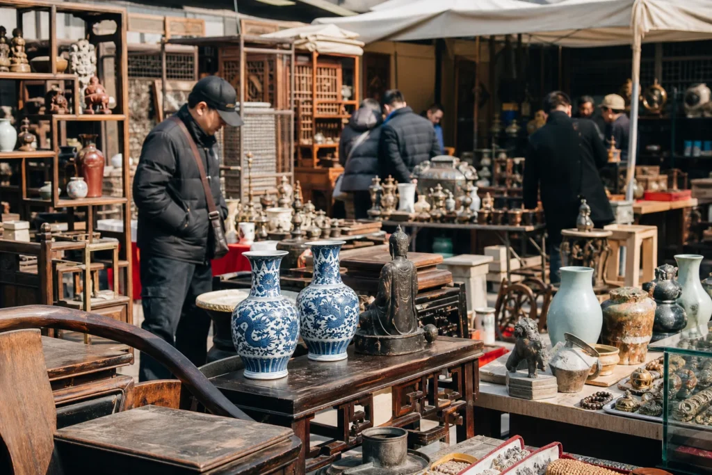 shoppers browsing antique and vintage market stalls at Panjiayuan Flea Market in China