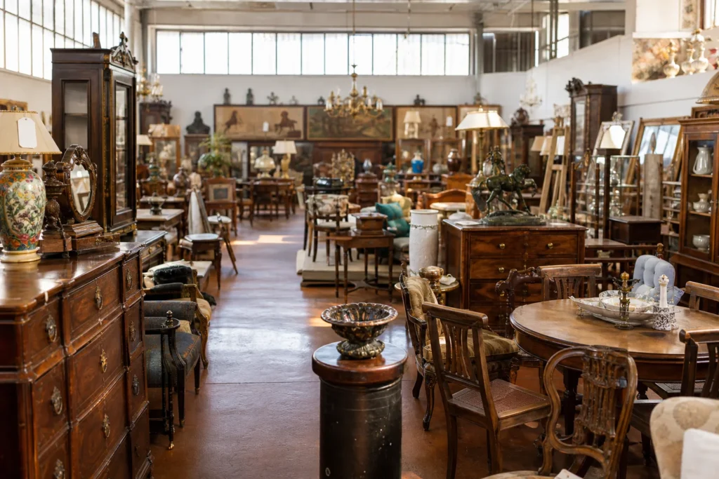 shoppers browsing antique and vintage market stalls at Parino Mercato Antiquario in Italy