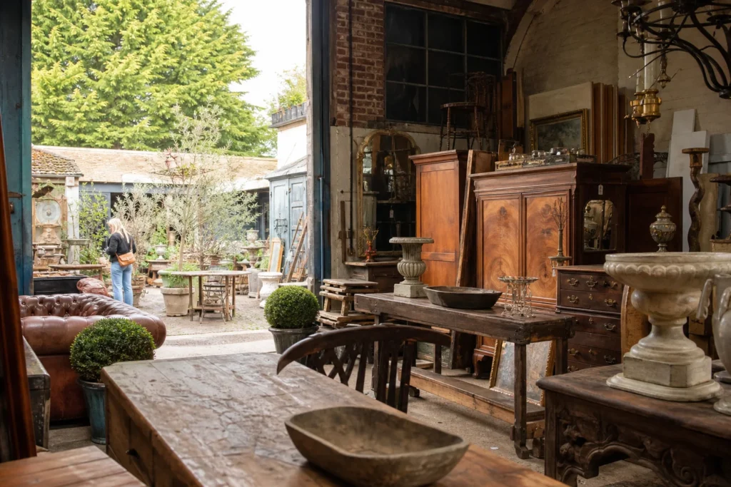 shoppers browsing antique and vintage market stalls at Pastorale Antiques in United Kingdom