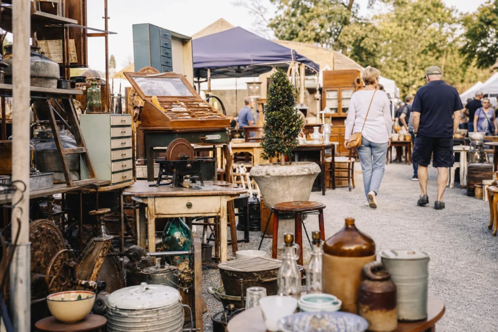 shoppers browsing antique and vintage market stalls at Recyclerama in Queensland