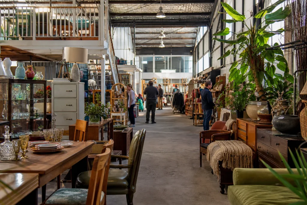 shoppers browsing antique and vintage market stalls at Relove Oxley in Brisbane