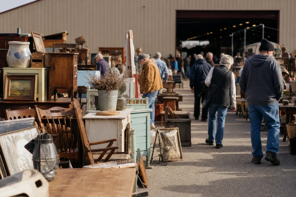 shoppers browsing antique and vintage market stalls at Renningers Adamstown Antiques Market in Pennsylvania