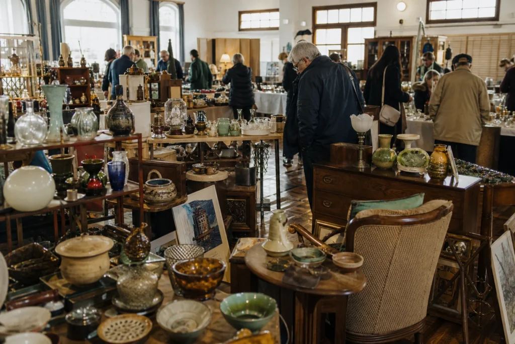 shoppers browsing antique and vintage market stalls at Retro Design & Antiques Fair in British Columbia, Canada, Vancouver