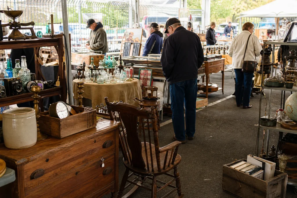 shoppers browsing antique and vintage market stalls at Royal Oak Antiques and Collectibles in Michigan