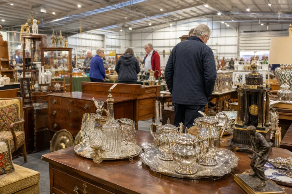 shoppers browsing antique and vintage market stalls at Shepton Mallet Antiques, Vintage & Collectors Fair in United Kingdom