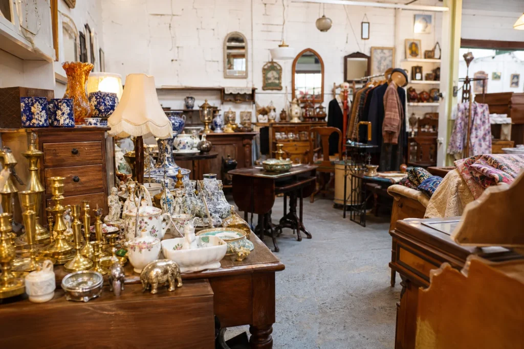 shoppers browsing antique and vintage market stalls at The Alleyways Antiques Center in United Kingdom