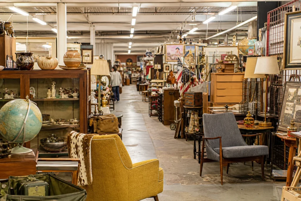 shoppers browsing antique and vintage market stalls at The Austin Antique Mall in Texas