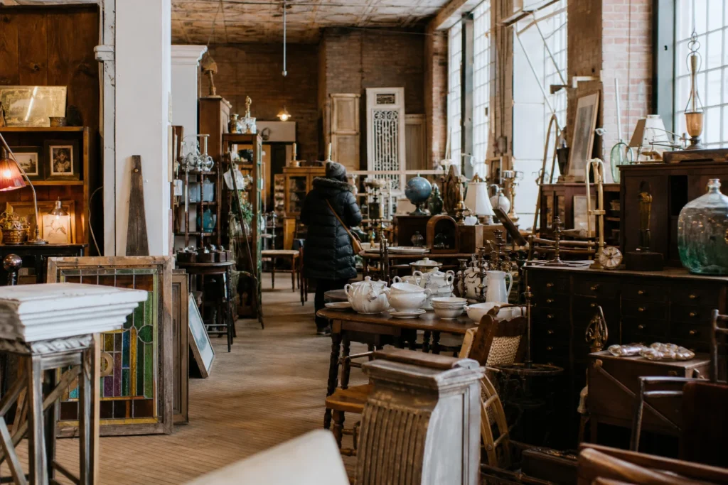 shoppers browsing antique and vintage market stalls at The Old House Revival Company in Canada, Manitoba