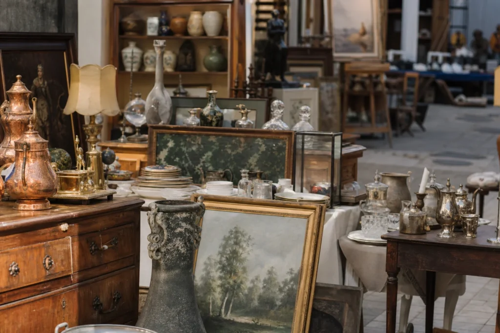 shoppers browsing antique and vintage market stalls at The Saleroom in Place Charles David, 30400 Villeneuve-lès-Avignon, France