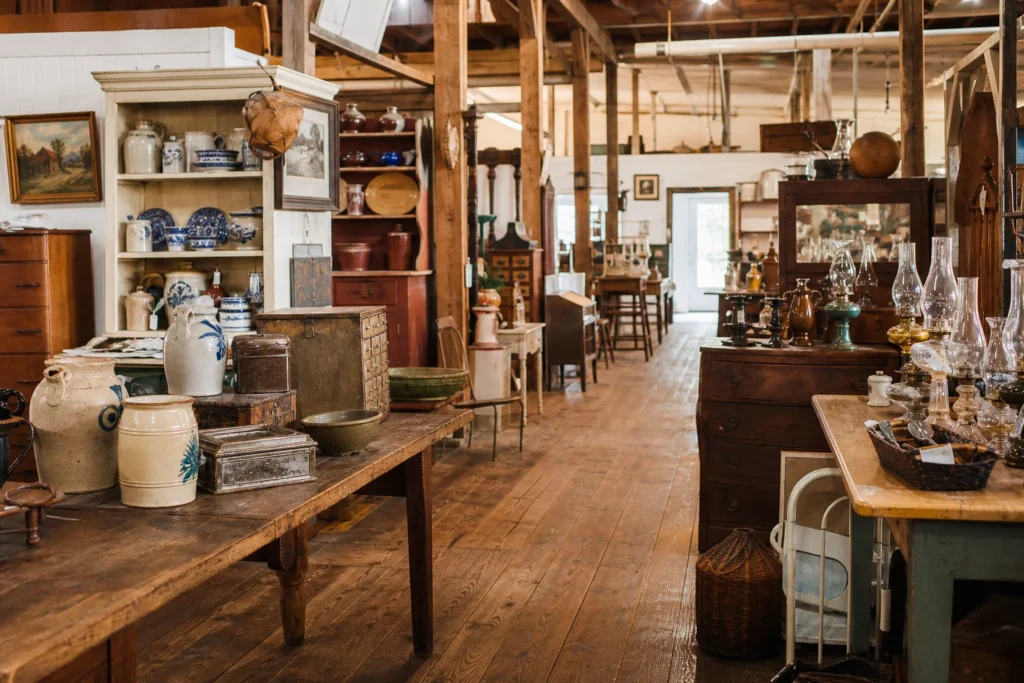shoppers browsing antique and vintage market stalls at The Shops at Marlborough Barn in Connecticut