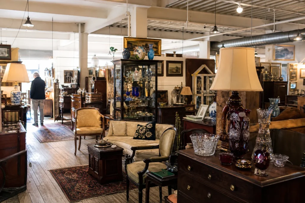 shoppers browsing antique and vintage market stalls at The Summit Antiques Center in New Jersey
