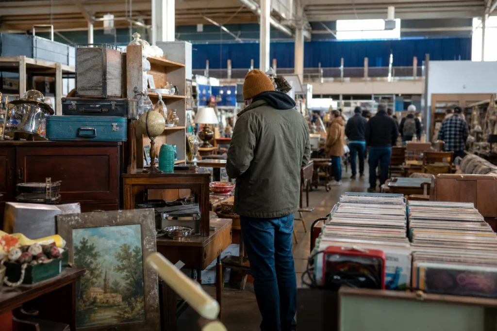 shoppers browsing antique and vintage market stalls at Tulsa Flea Market in Oklahoma