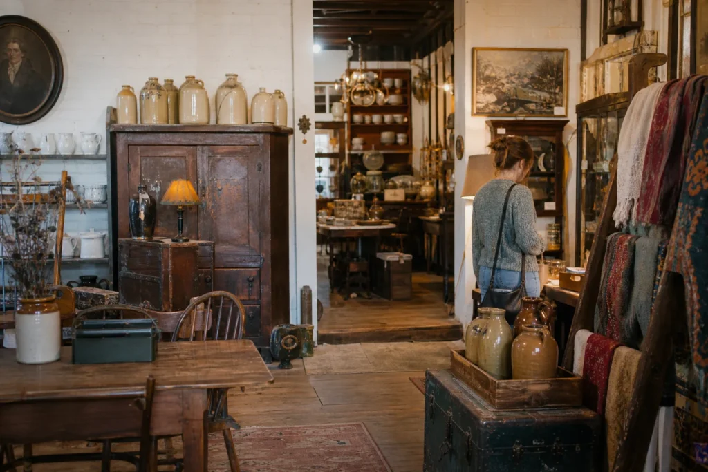 shoppers browsing antique and vintage market stalls at Tuscaloosa’s Antique District in Alabama