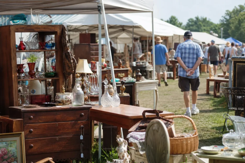 shoppers browsing antique and vintage market stalls at US 12 Heritage Trail Garage Sale in Michigan