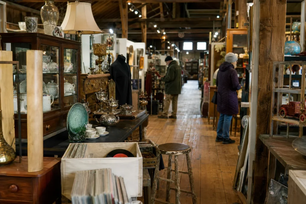 shoppers browsing antique and vintage market stalls at Vermont Antique Mall