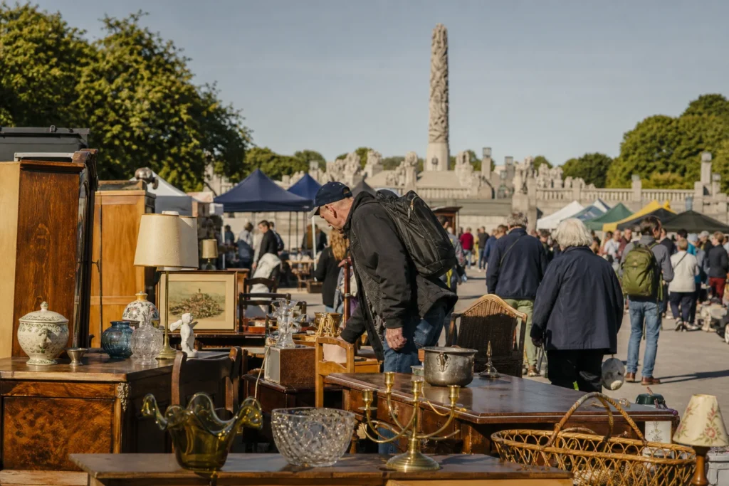 shoppers browsing antique and vintage market stalls at Vestkanttorvet in Norway