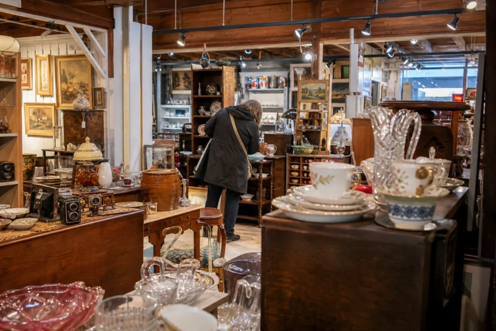 shoppers browsing antique and vintage market stalls at Village Antiques Mall in British Columbia, Vancouver
