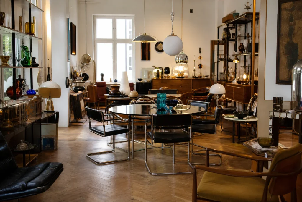 shoppers browsing antique and vintage market stalls at Vintagerie – the modernist showroom in Austria