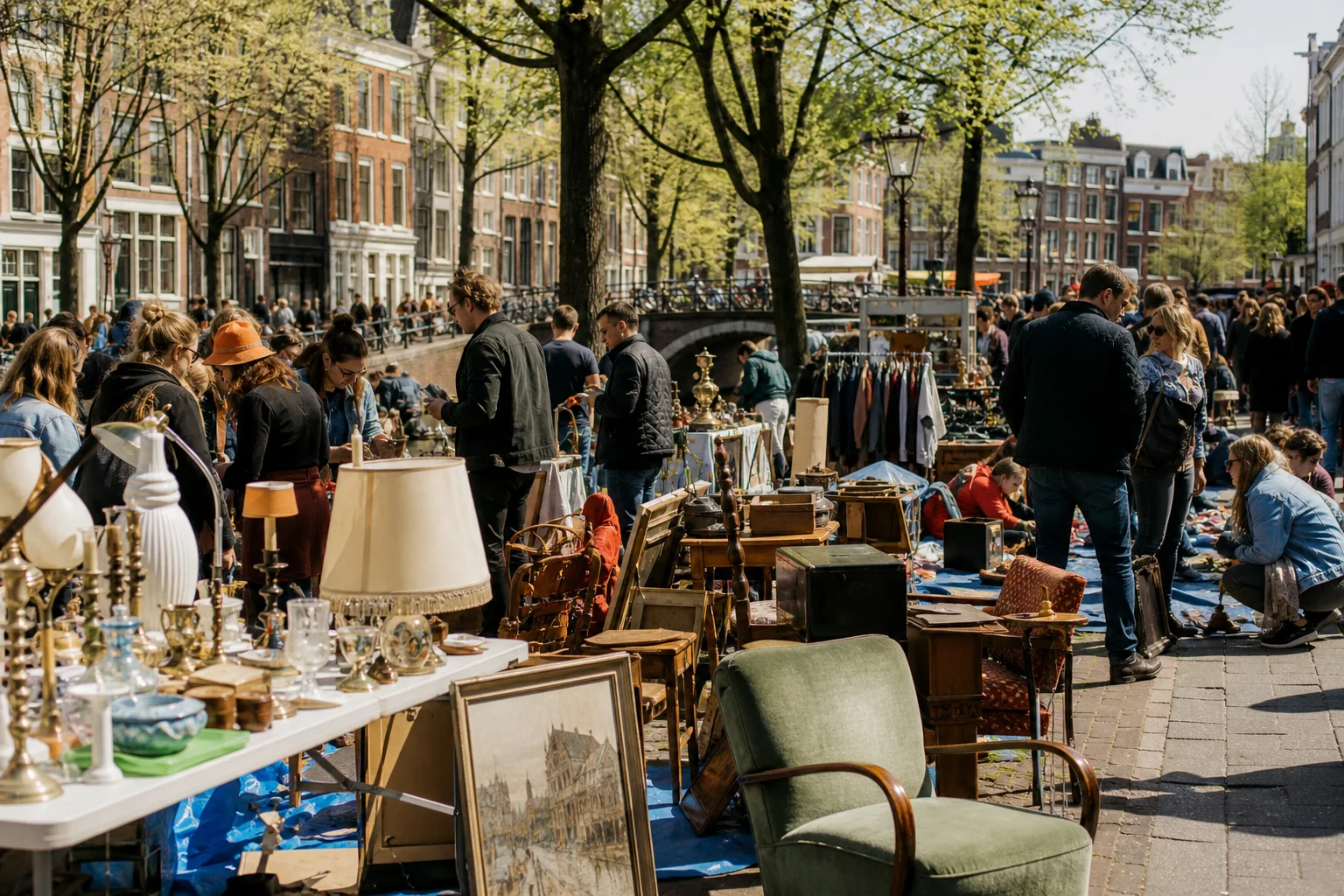 shoppers browsing antique and vintage market stalls at Vrijmarkt Amsterdam in Amsterdam, Netherlands