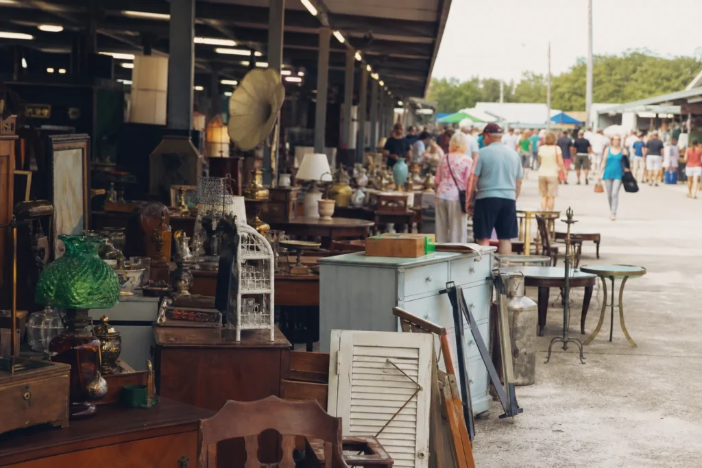 shoppers browsing antique and vintage market stalls at Wagon Wheel Flea Market & Mustang Flea Market in Florida