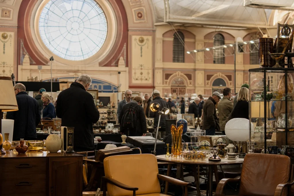 shoppers browsing antique and vintage market stalls at Alexandra Palace Antiques & Collectors Fair in London