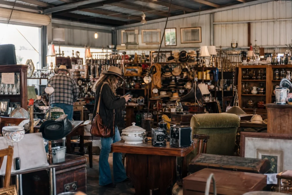 shoppers browsing antique and vintage market stalls at Bussey’s Flea Market in Texas
