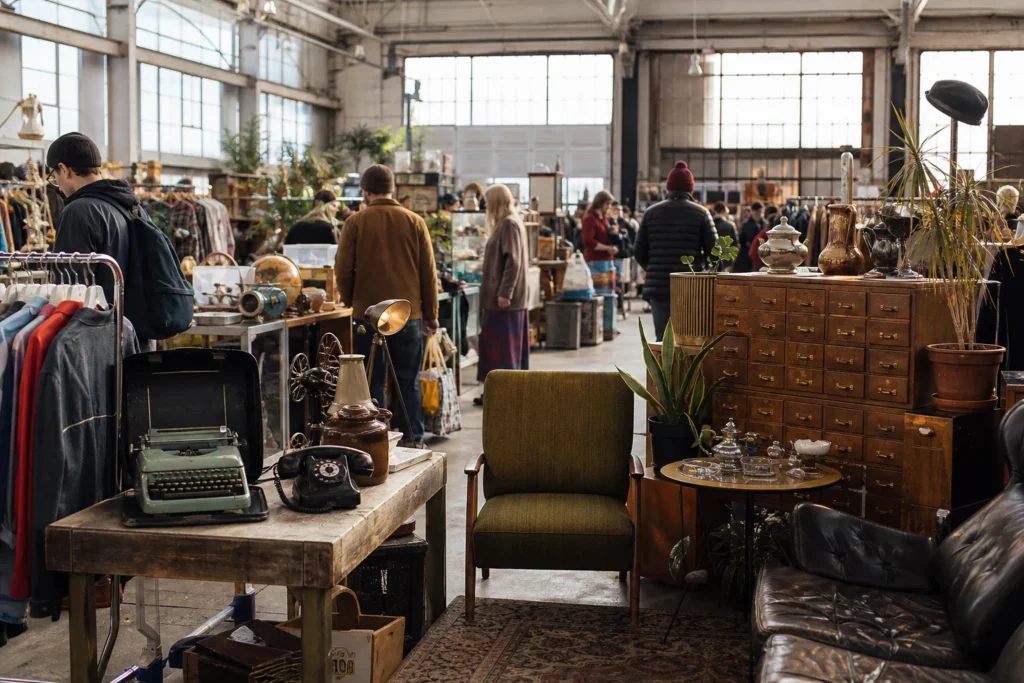 shoppers browsing antique and vintage market stalls at Eastside Flea in British Columbia, Canada, Vancouver