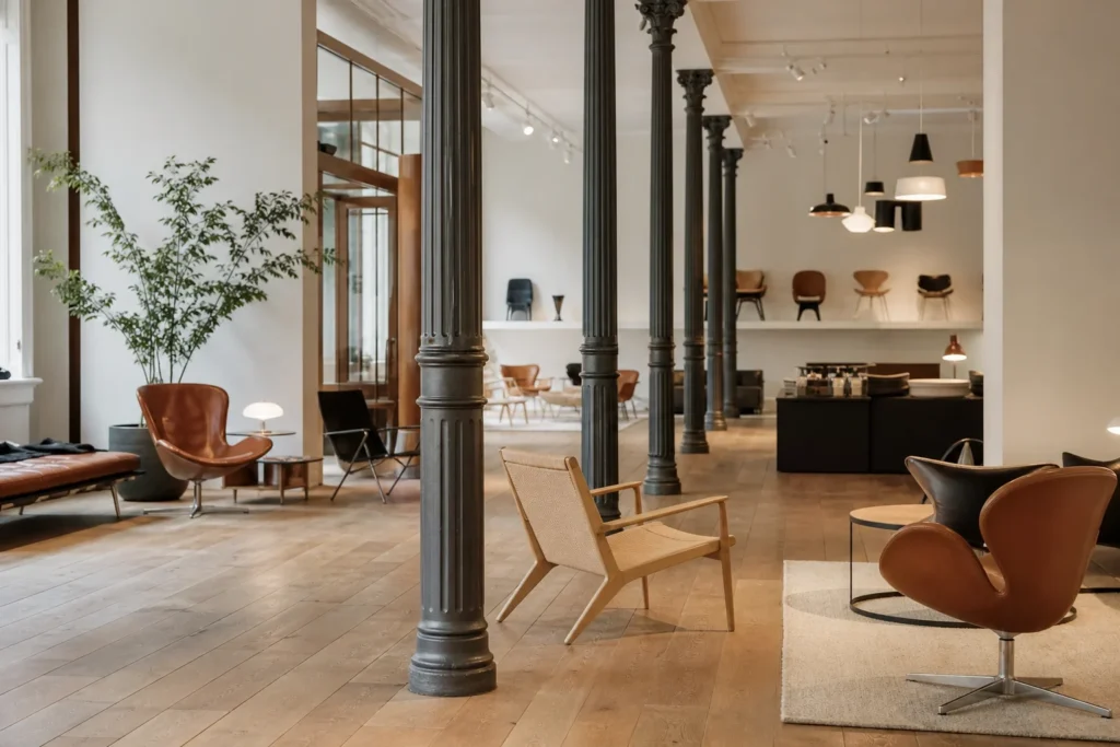 shoppers browsing antique and vintage market stalls at Fritz Hansen in Copenhagen
