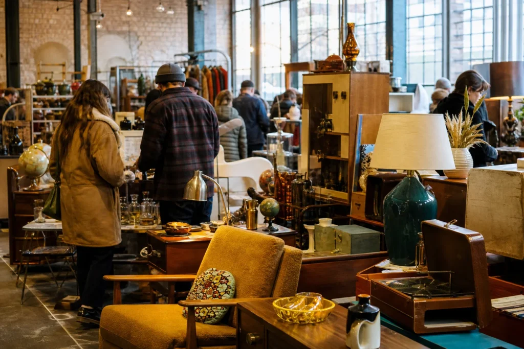 shoppers browsing antique and vintage market stalls at Vintage Garage Chicago in Chicago, Illinois